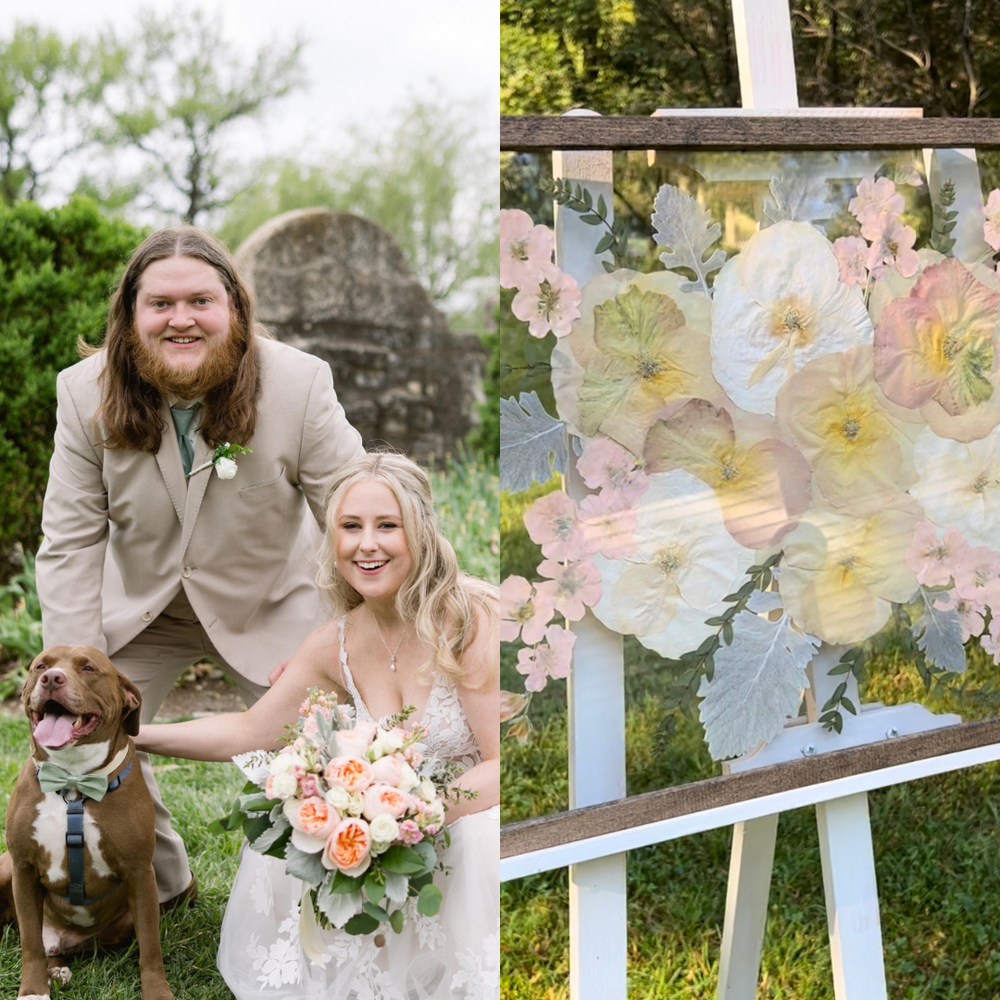 On the left, the newlyweds pose for a photo with their dog during their wedding day. The bride, wearing a stunning lace gown, holds a beautiful bouquet filled with soft peach roses, white flowers, and greenery, while the groom, in a beige suit, smiles alongside her. Their dog, wearing a matching green bow tie, sits happily by their side. On the right, the pressed floral artwork made using the bride's bouquet is displayed on an easel. The artwork showcases the delicate peach, pink, and white flowers from the